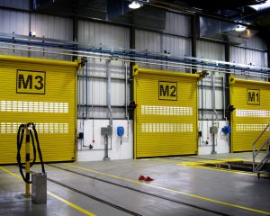 Three Yellow Roller Shutter Doors